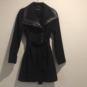 Black winter dress coat with faux leather trim.